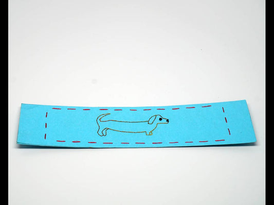Sky-blue bookmark with embroidered dog