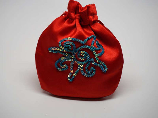 Red pouch with handmade embroidered sun