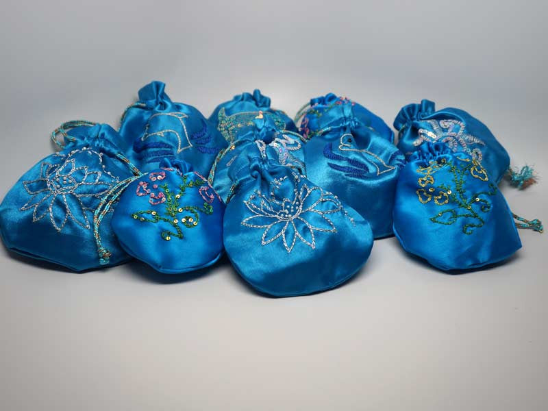 10 assorted blue pouches with handmade embroidery