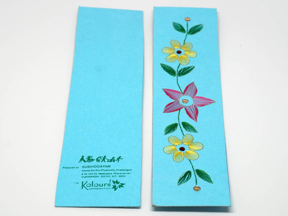 Sky-blue bookmark with embroidered flower