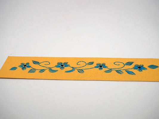 Yellow bookmark embroidered by hand