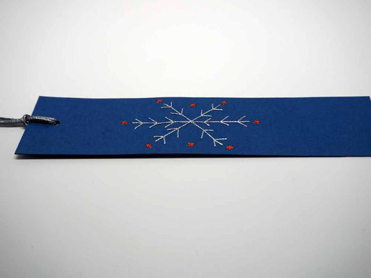 Blue bookmark embroidered by hand