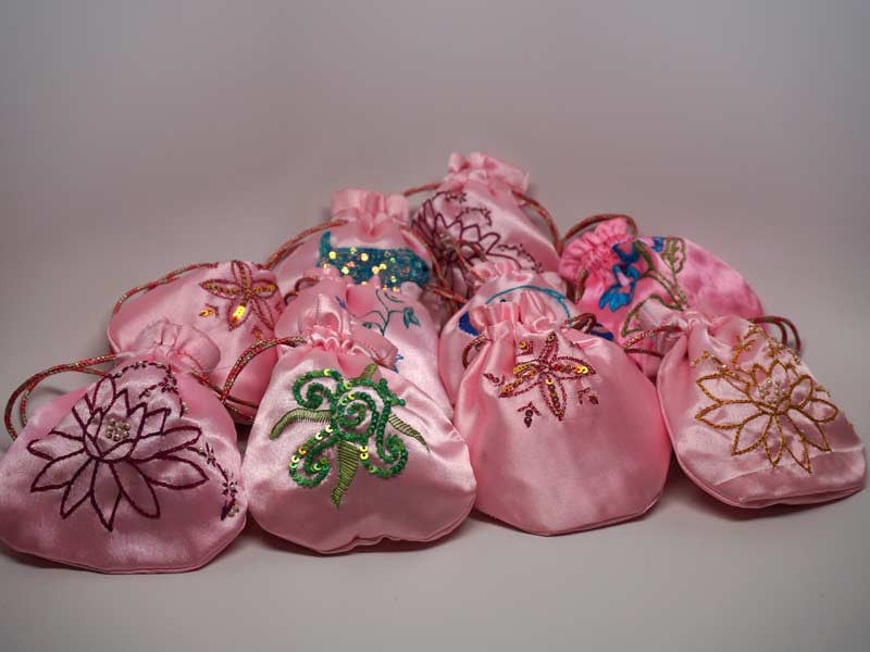 10 assorted pink pouches with handmade embroidery