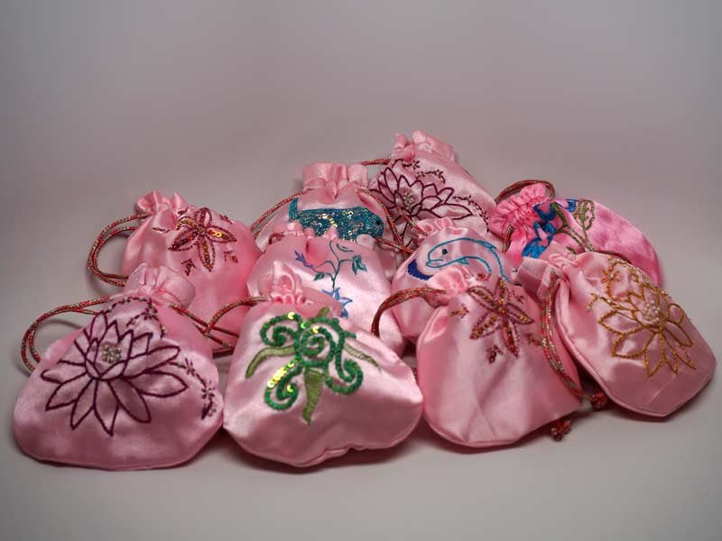 10 assorted pink pouches with handmade embroidery