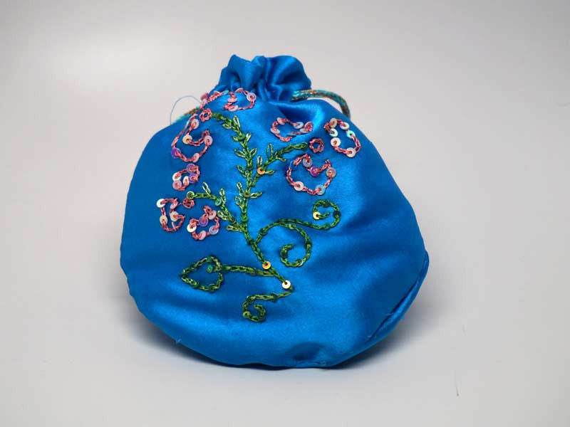 Blue pouch with handmade embroidered flower