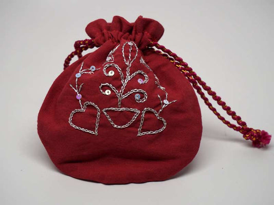 Wine color pouch with handmade embroidered silver design