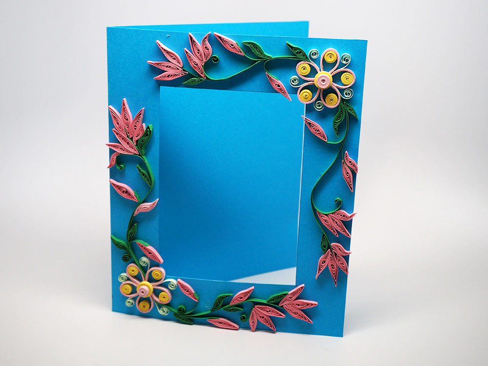 Photo frame with handmade paper filligree flowers decorations