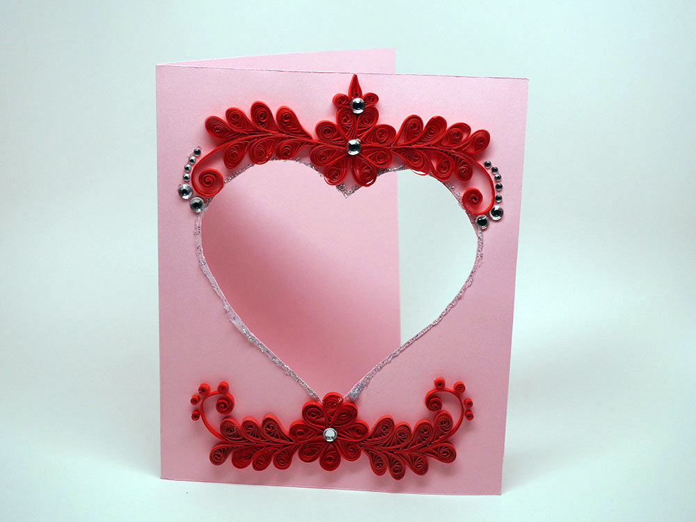 Photo frame with handmade paper filligree love decoration