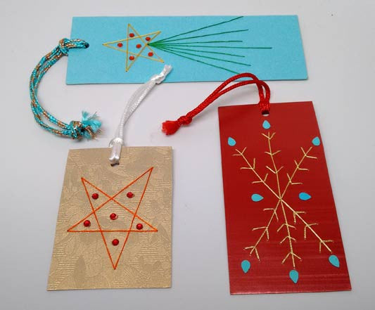 Assorted Christmas gift tags embroidered by hand