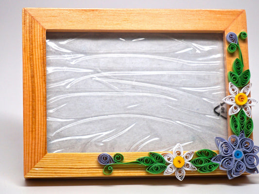 Paper filligree 3D photo frame with handmade flower decorations